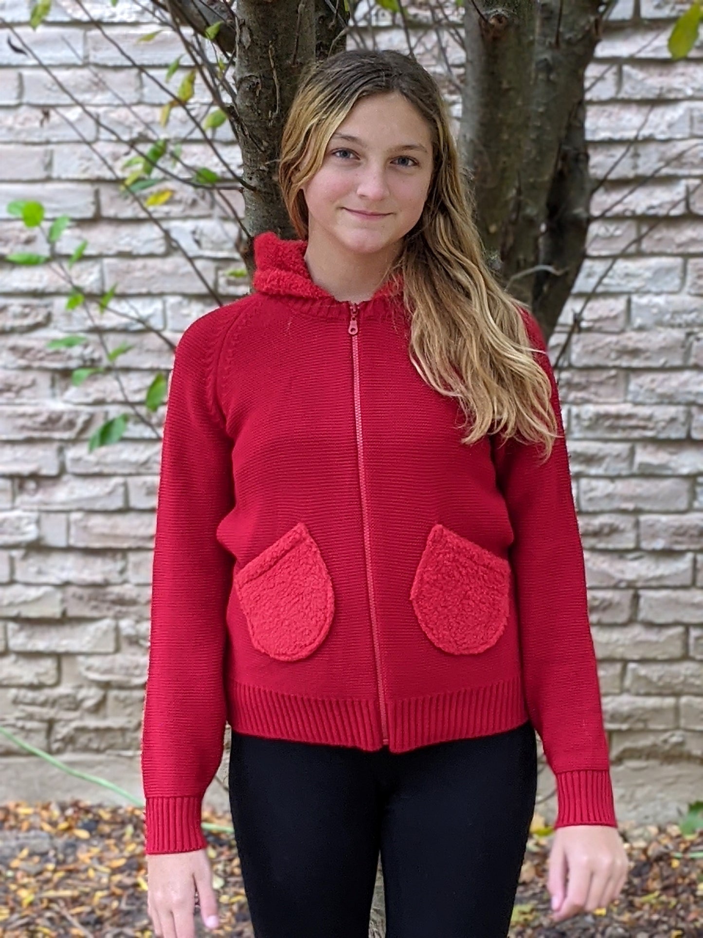 Sweater hoodie with fur pockets
